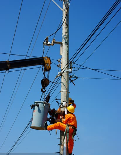 Line construction workers working at height